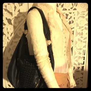 Black studded shoulder bag
